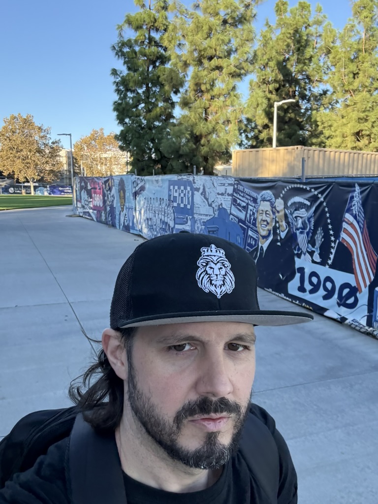 CrimineyJay wearing a black cap outdoors